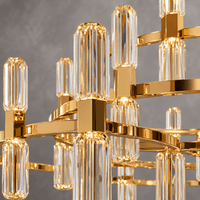 Close-up of the Athena Grand Tiered Crystal Chandelier with gold finish and A+ crystal prisms