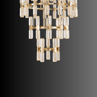 Detail of cascading crystal prisms forming the lower tier of a luxury large crystal chandelier.
