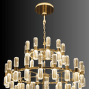 Close-up of gold tiered chandelier structure with faceted crystal prisms and integrated LED lighting.