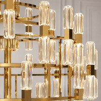 Close-up of Athena Royale luxury crystal chandelier showcasing faceted crystal and polished gold structure