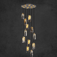 Video thumbnail showing Aurora Lava Murano-style chandelier glowing softly, featuring sculptural glass pendants.
