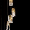 Close-up of Aurora Lava Murano-style hand-blown glass pendants showing golden glow, textured glass detail, and brass fittings