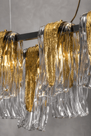 Close-up of Aurora Magma luxury chandelier with hand-formed Murano style glass and textured brass detailing
