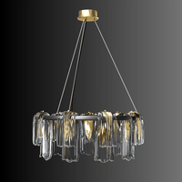 Modern Aurora Sublime chandelier photographed on a black background, highlighting brass frame and sculptural Murano-style glass.