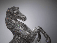 Detailed view of AZAR crystal horse head highlighting precision-cut crystal placement