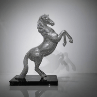 Front view of AZAR crystal stallion sculpture showing dramatic rearing posture and crystal brilliance
