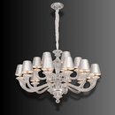 Front view of Cadogan crystal chandelier with tailored ivory shades and silver-toned structure