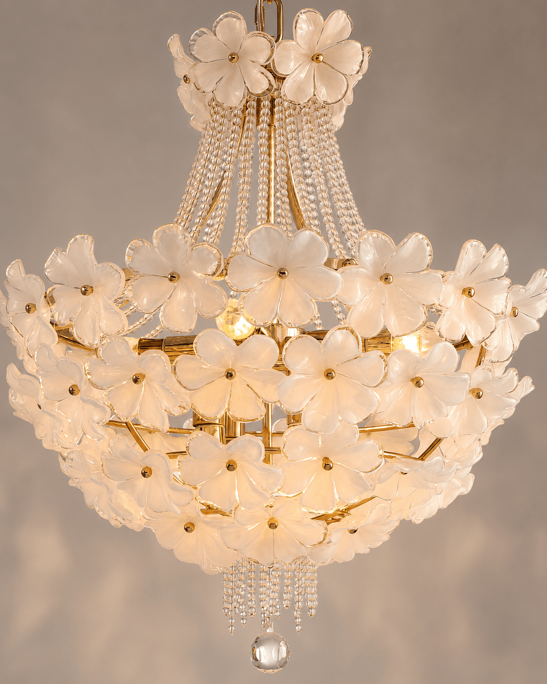 Diameter 55 cm Camellia Bloom Chandelier close- up shot against a warm light grey background.