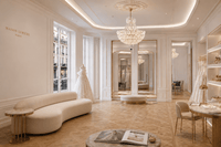 Camellia Bloom Chandelier installed in a bridal boutique in paris with wood floor and luxurious furnitures.