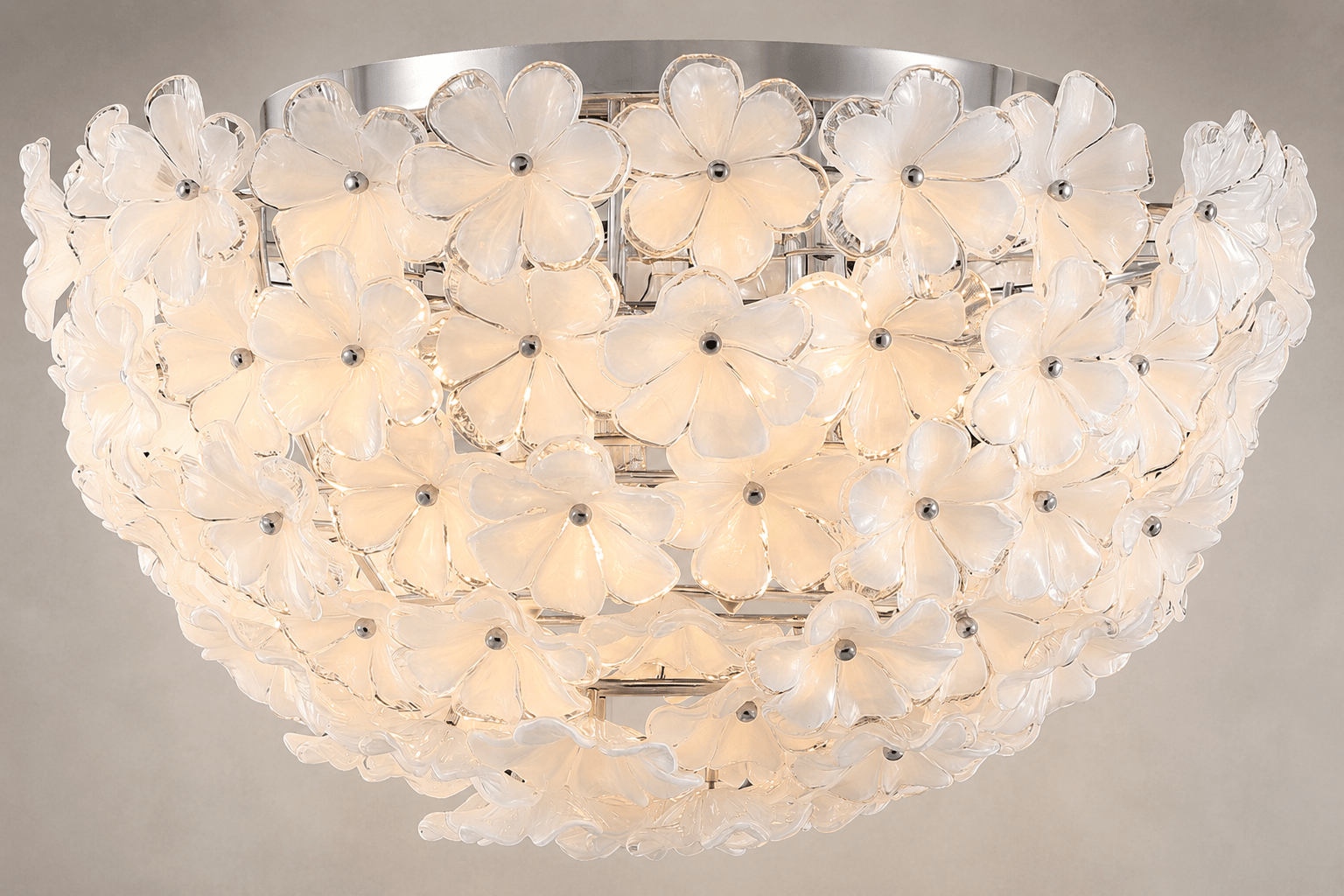 Close-up of Camellia Fiorita Flush ceiling light with sculpted floral glass and polished steel frame.