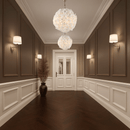 Two Camellia Fiorita Globe chandeliers lighting a classic hallway with panelled walls.