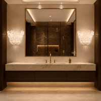 Murano-style floral wall sconces installed beside a bathroom mirror in a luxury interior.
