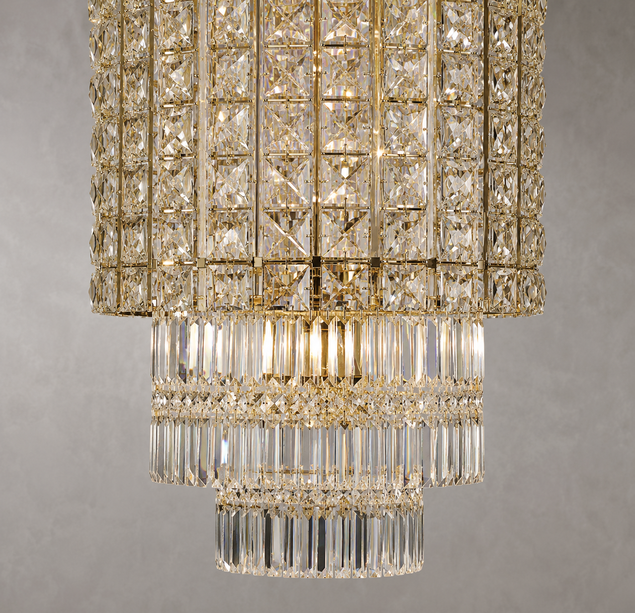 Close-up of the Plaza Crown Crystal Chandelier with tiered crystal prisms and luxury gold-plated finish