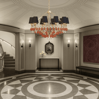 Donatello Eleganza gold chandelier with black shades and Murano-style glass displayed in a luxury foyer interior setting.