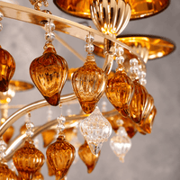 Luce Regale Donatello Grande chandelier close-up with amber Murano-style glass and gold frame