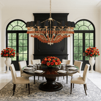 Donatello Imperiale chandelier in a luxury dining room, featuring amber Murano-style glass and black shades and a gold frame.