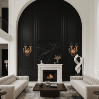 Murano-style Donatello Regal Glow wall lamps illuminating an upscale living room with black paneling, gold accents.