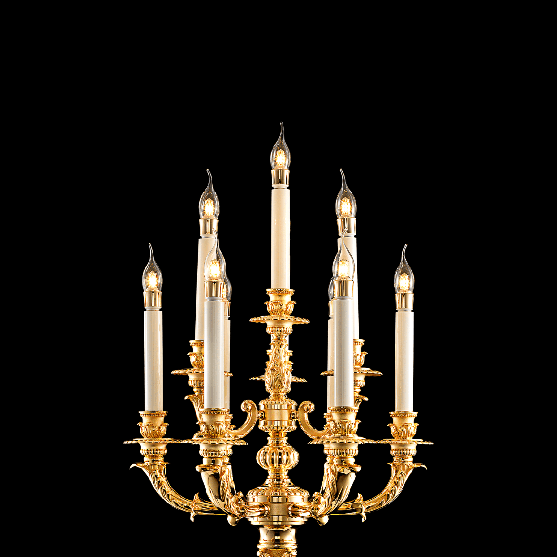 Close-up of multi-arm French Empire candélabre showing candle-style lights and gold finish