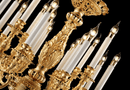 close-up of 24K gold plated chandelier arms and candle lights showing detailed French Empire craftsmanship