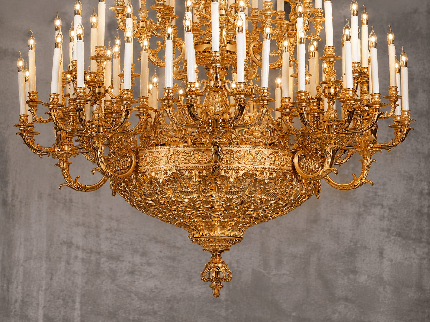 Close-up of Élysée Grand Impériale luxury gold chandelier with handcrafted ornate details and candle lights