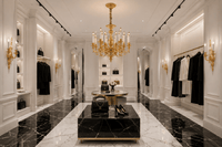 Élysée Régence luxury chandelier in a modern designer boutique with black and white marble flooring
