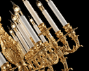 close-up of 24K gold plated chandelier arms and candle lights, detailed French Empire craftsmanship