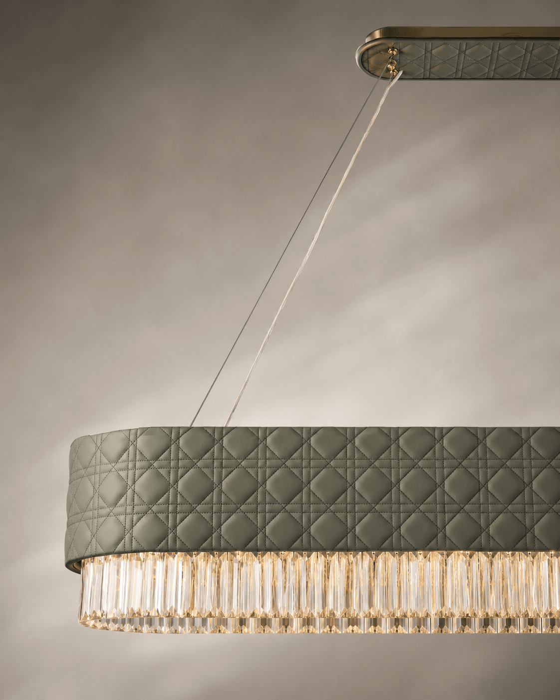 Close-up of Florence Trapunto Ardesia linear chandelier in sage quilted leather and clear crystal