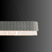 Close-up of Florence Trapunto Ardesia chandelier highlighting quilted grey leather and Asfour crystal craftsmanship.