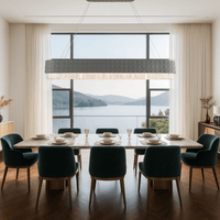 Florence Trapunto Ardesia chandelier above luxury dining table, creating refined ambient glow with Asfour crystal.