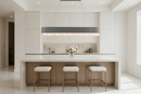 Florence Trapunto Ardesia chandelier above white marble kitchen island, blending modern elegance and symmetry.