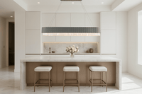 Florence Trapunto Ardesia chandelier above white marble kitchen island, blending modern elegance and symmetry.