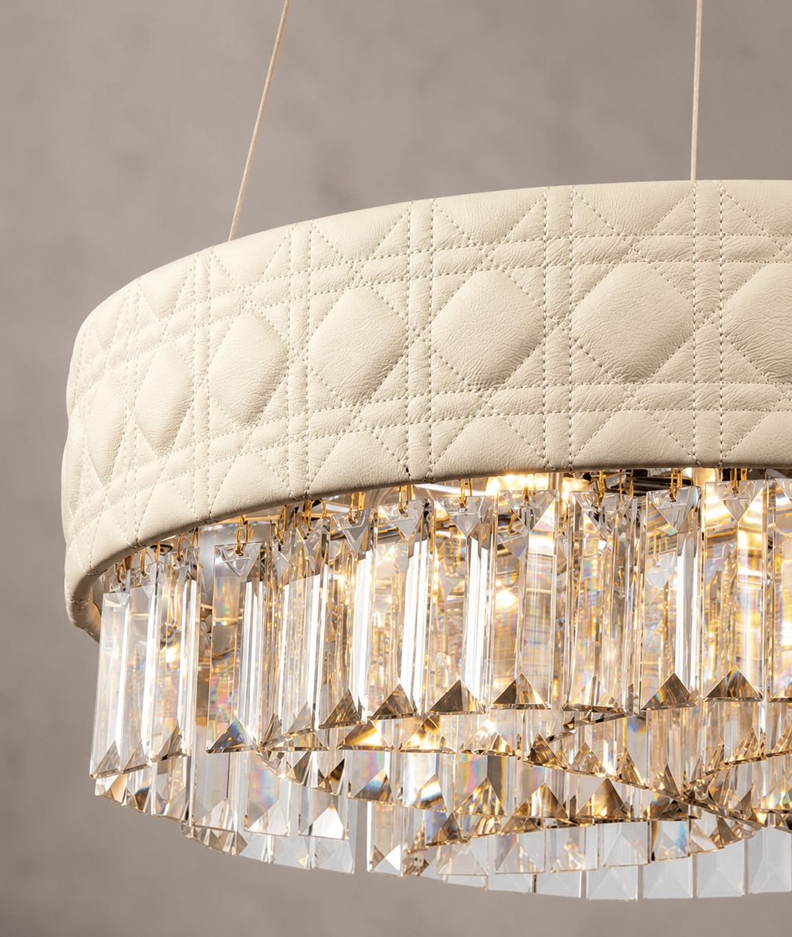 Close-up of Florence Trapunto Avorio chandelier with quilted ivory leather and clear crystal prisms.