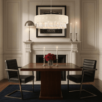 Florence Trapunto Avorio chandelier by HDLS Lighting Ltd illuminating a modern dining room with quilted ivory shade and crystal prisms above a wooden table.