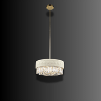 Side view of Florence Trapunto Lucea luxury pendant showing quilted ivory leather, polished gold details, and crystal.