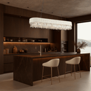 Florence Trapunto Neve chandelier illuminating a warm-toned modern kitchen dining area.