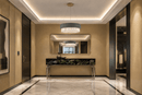 Florence Trapunto Salvia sage leather chandelier in a luxury London penthouse entrance.