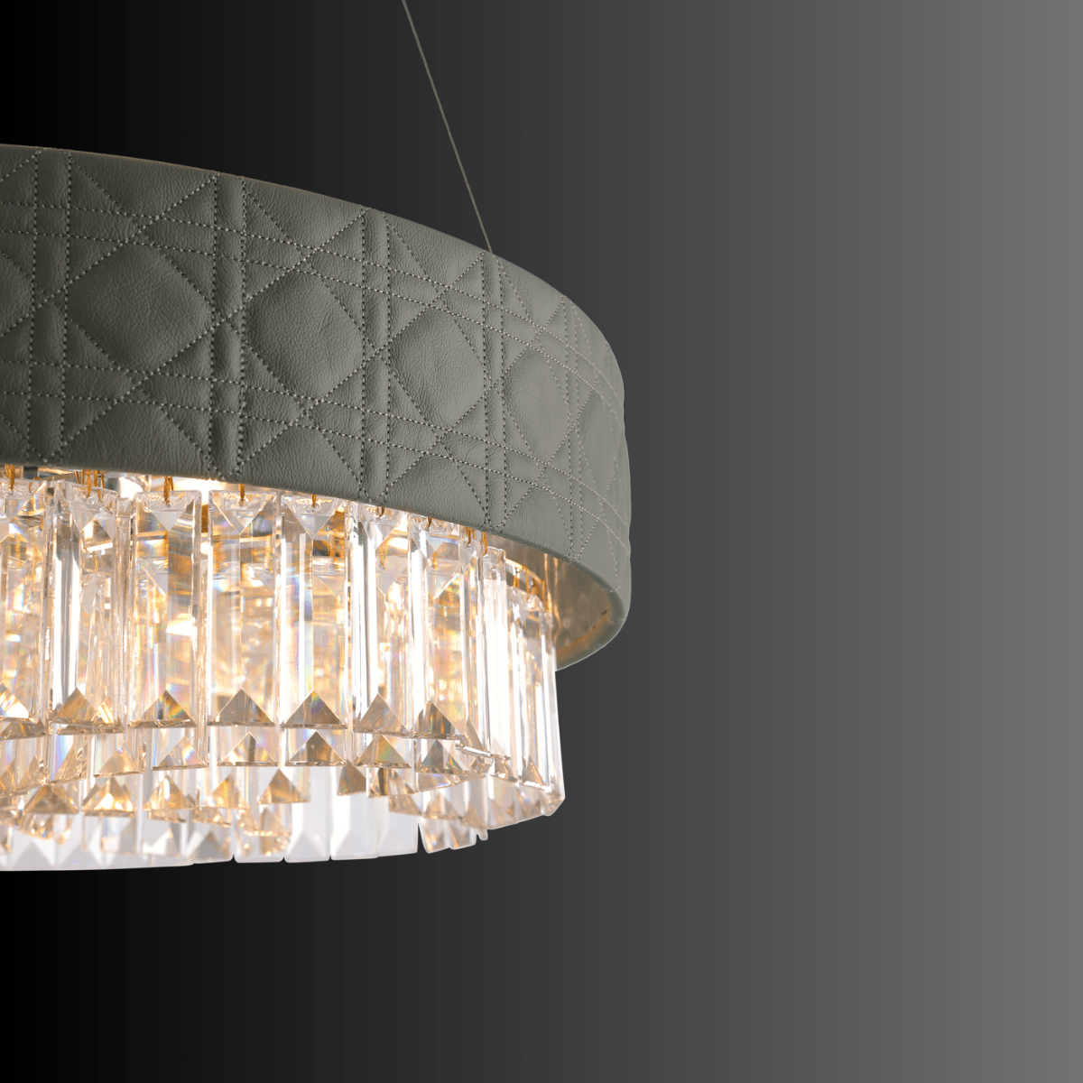 Close-up of a designer chandelier with a leather-textured green shade and crystal details on a dark background