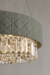 Close-up of Florence Trapunto Salvia chandelier with quilted sage leather and clear crystals.