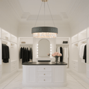 Florence Trapunto Salvia chandelier lighting a white dressing room with luxury modern decor.