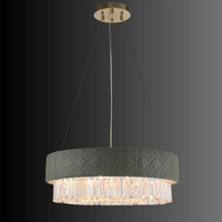 Luxury Florence Trapunto Salvia chandelier on black background showing quilted leather and crystals.