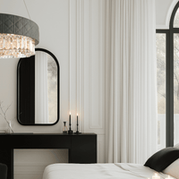 Florence Trapunto Salvia chandelier illuminating a modern bedroom with elegant neutral tones