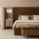 Florence Trapunto Thalia luxury table lamp styled in an elegant master bedroom beside upholstered nightstands.