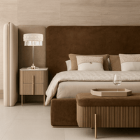 Florence Trapunto Thalia luxury table lamp styled in an elegant master bedroom beside upholstered nightstands.