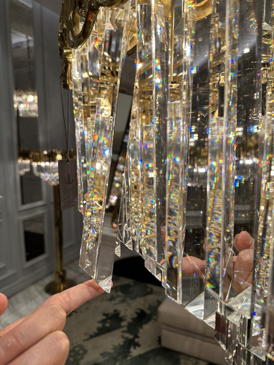Thick crystal elements at architectural scale, demonstrating weight, clarity, and material quality in a grand scale chandelier.