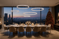 Five-ring crystal chandelier illuminating a luxury dining room with modern furnishings, warm LED lighting.