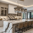 Aurora Magma linear brass chandelier above an elegant marble kitchen island in a high-end contemporary interior.