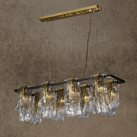 Luxury Aurora Magma linear chandelier with brass frame and hand-formed Murano-style glass, shown front-facing in modern interior.