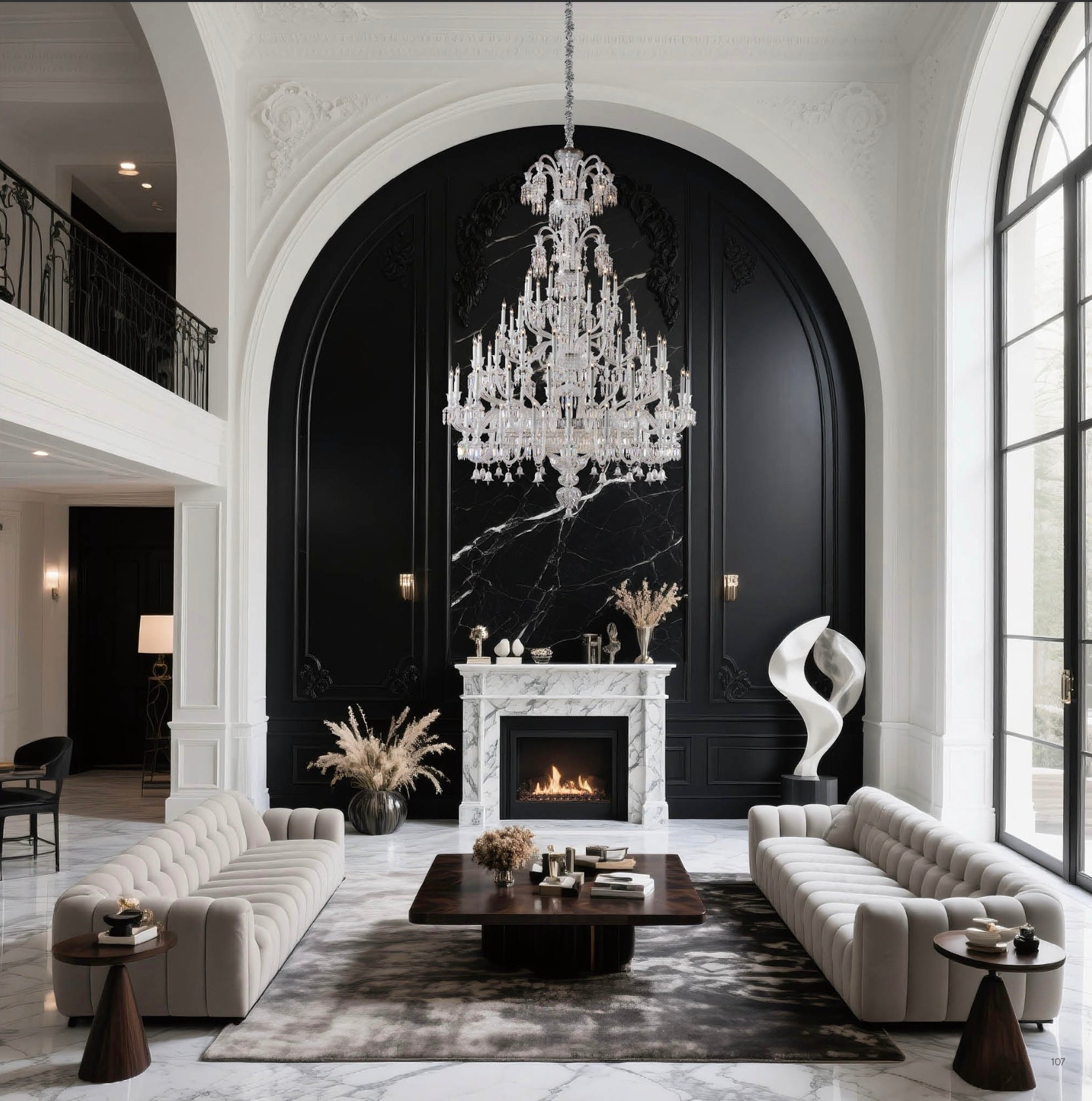 Grand crystal chandelier by HDLS Lighting Ltd suspended above a luxury living room with black marble fireplace and elegant white interiors.
