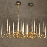 Gala chandelier by HDLS in front of a light brown background with light on