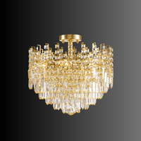 Maurice Doré chandelier on dark background showcasing gold-finished frame and shimmering Asfour crystals in a modern semi-flush silhouette.